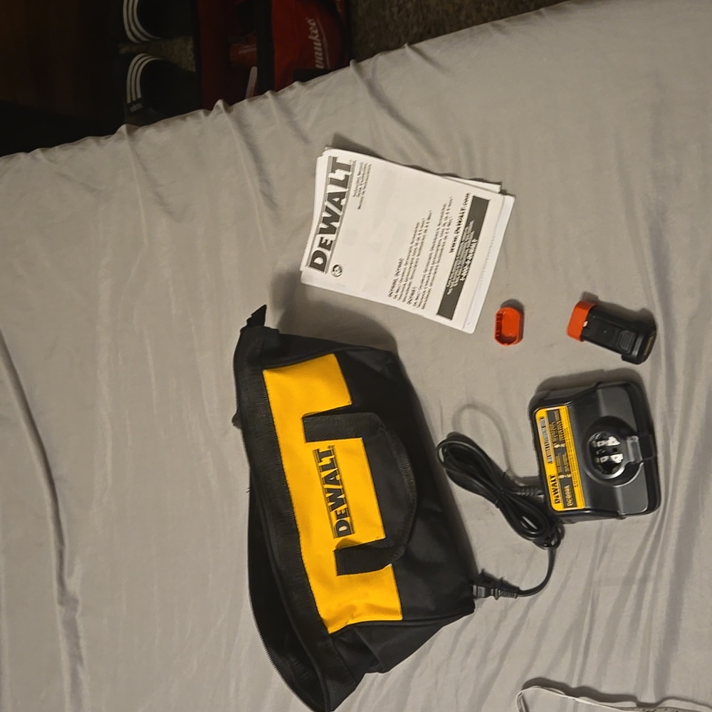 Dewalt case, charger, One 8v max battery, 2 battery covers & manual